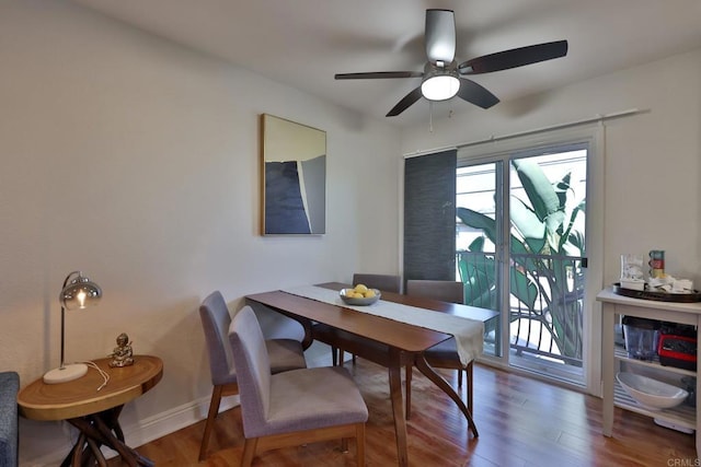 dining room with ceiling fan, wood finished floors, and baseboards