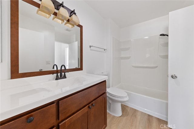 full bathroom featuring visible vents, wood finished floors, vanity, and toilet