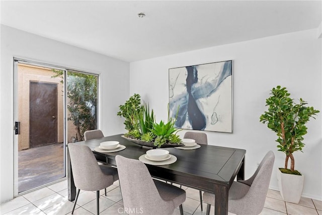 dining space featuring light tile patterned floors