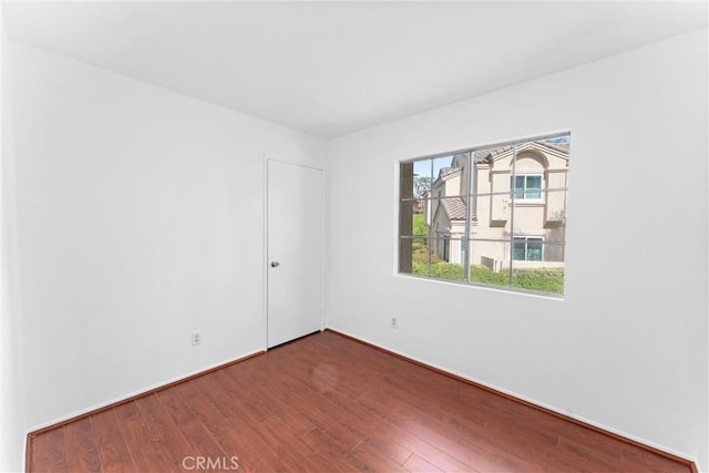 unfurnished room featuring wood finished floors