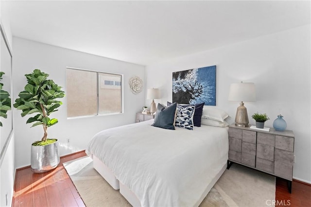 bedroom with wood finished floors