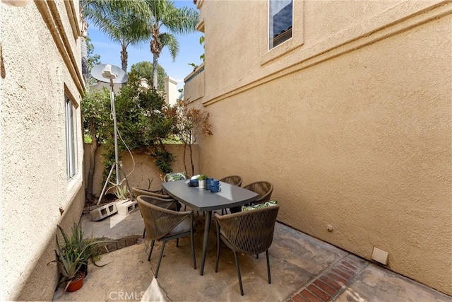 view of patio / terrace featuring outdoor dining area and fence