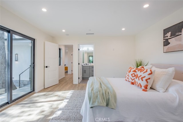 bedroom with access to outside, visible vents, light wood-style flooring, and recessed lighting