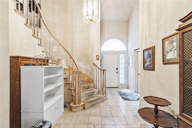 1640 Pembroke Way, Dixon, CA 95620 - foyer entrance featuring a towering ceiling, stairs, light tile patterned floors, and a chandelier