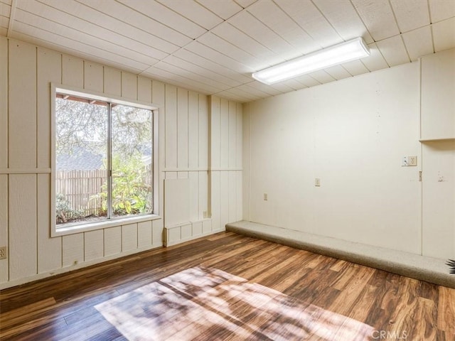 spare room with wood finished floors