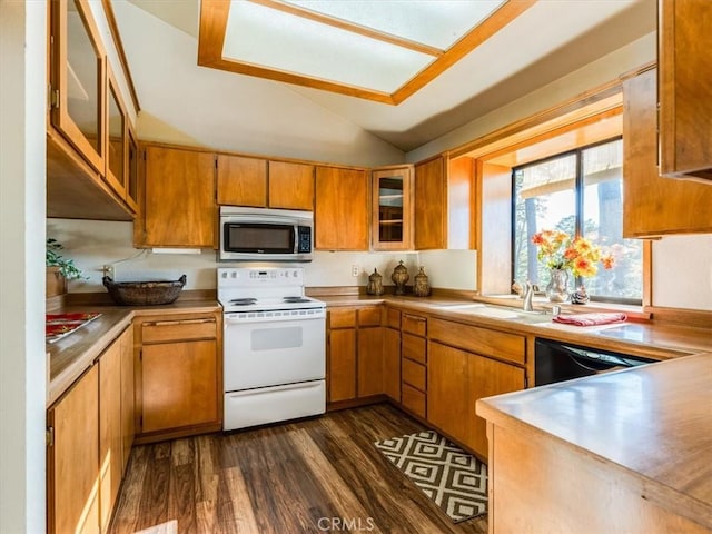 kitchen featuring a sink, light countertops, dishwasher, stainless steel microwave, and white electric range oven