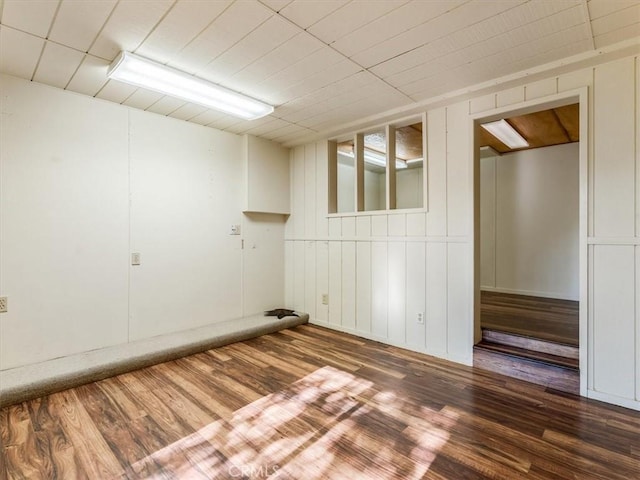 spare room featuring wood finished floors