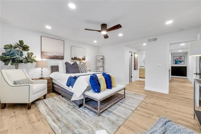 bedroom featuring visible vents, baseboards, light wood-style flooring, ceiling fan, and recessed lighting