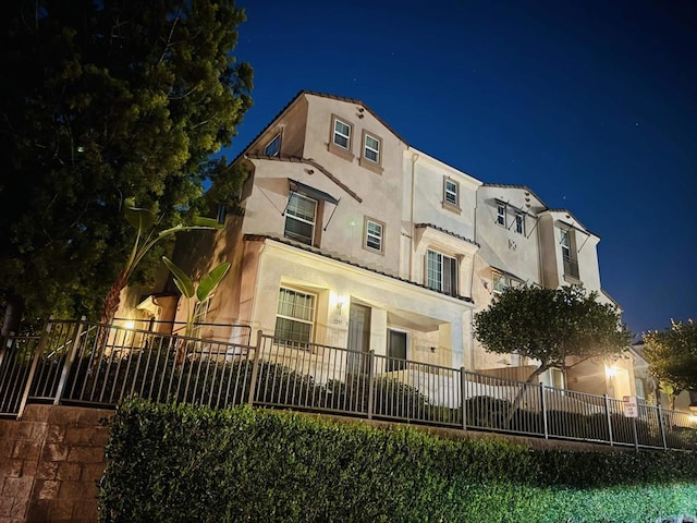 property at night with fence