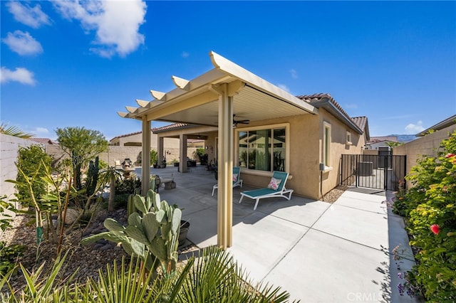 view of patio / terrace featuring a ceiling fan, a gate, and a fenced backyard