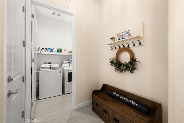 clothes washing area featuring washer and clothes dryer, laundry area, and visible vents