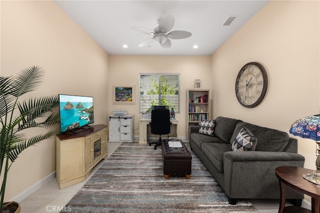 living room featuring recessed lighting, a ceiling fan, visible vents, and baseboards