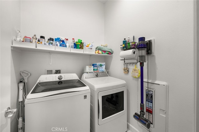 laundry room with laundry area and separate washer and dryer