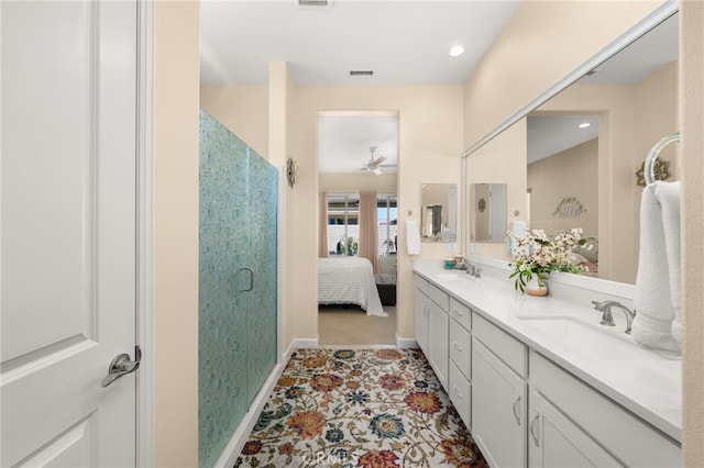 full bath featuring a sink, connected bathroom, double vanity, and a shower stall