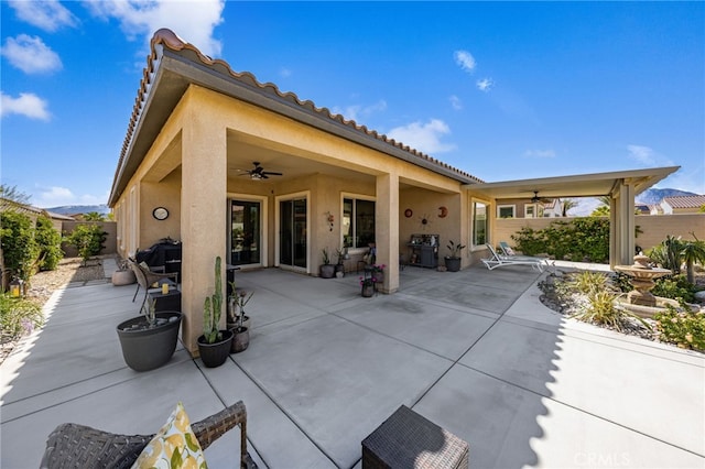 view of patio / terrace with a grill, a fenced backyard, and ceiling fan