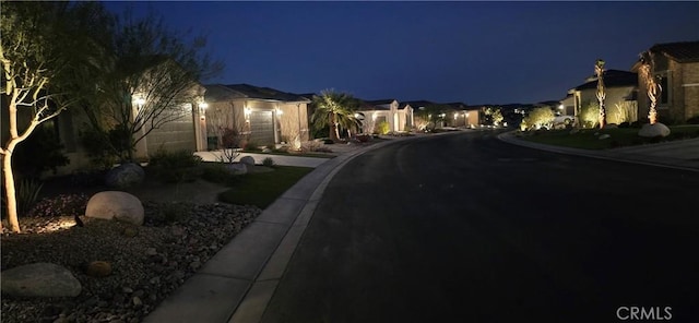 view of road with curbs and sidewalks