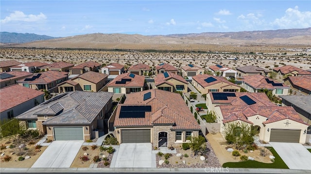 birds eye view of property with a residential view and a mountain view