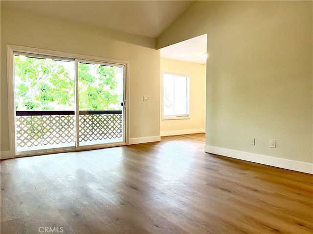 700 W La Veta # A4, Orange, CA 92868 - spare room featuring baseboards, wood finished floors, and vaulted ceiling