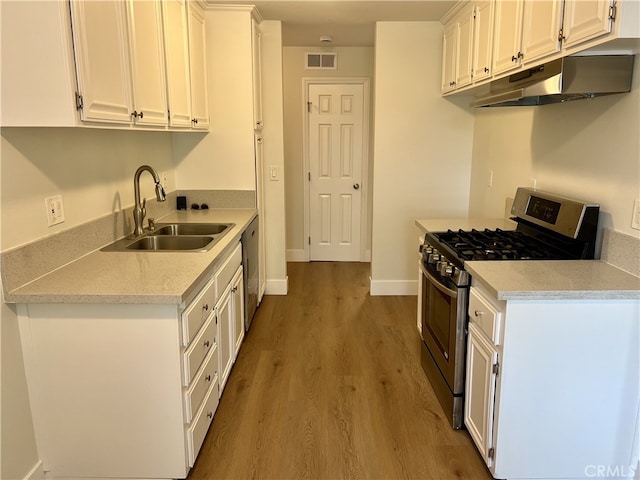 700 W La Veta # A4, Orange, CA 92868 - kitchen with stainless steel appliances, under cabinet range hood, a sink, and white cabinets