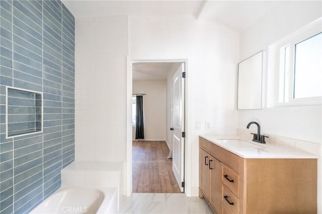 full bath featuring vaulted ceiling with beams and vanity