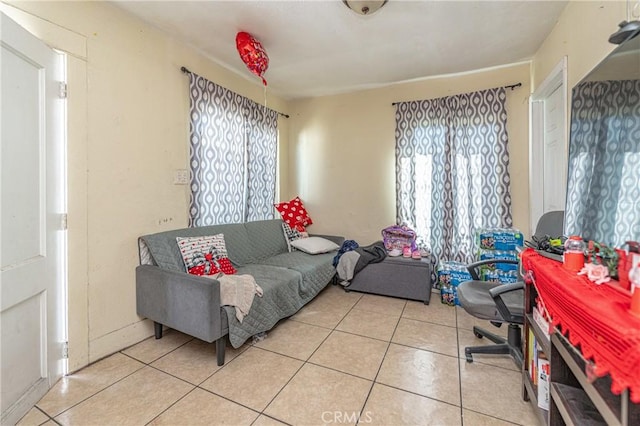 living room with a wealth of natural light and tile patterned floors