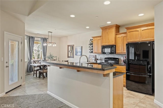 kitchen featuring dark countertops, decorative backsplash, recessed lighting, light tile patterned flooring, and black appliances