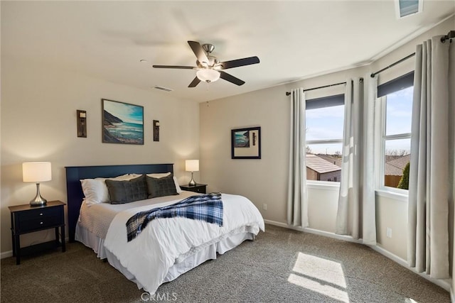 bedroom featuring carpet flooring, baseboards, and visible vents