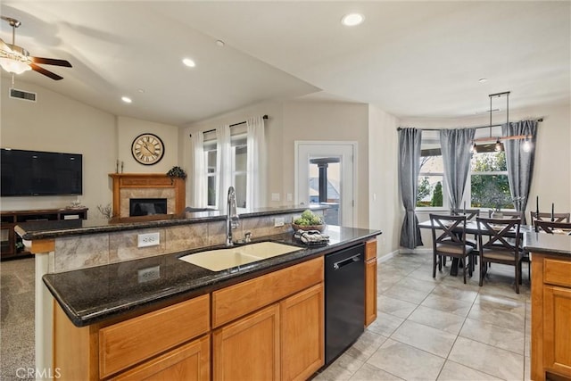 kitchen featuring visible vents, open floor plan, dishwasher, lofted ceiling, and a sink