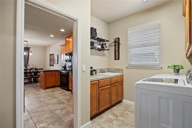 bathroom with tile patterned flooring, recessed lighting, independent washer and dryer, and vanity