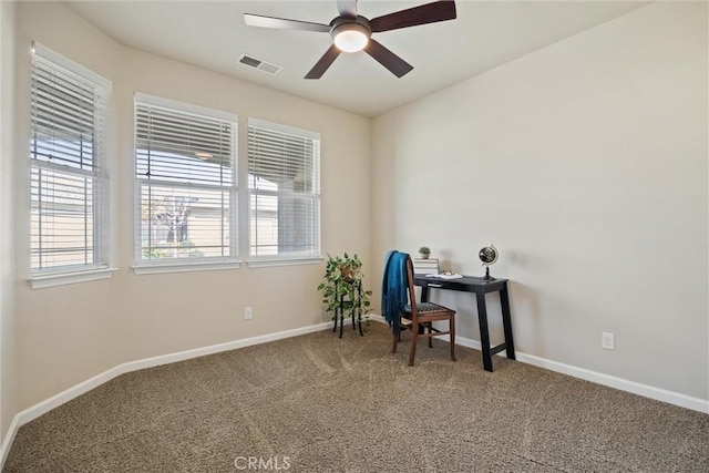 carpeted home office with visible vents, baseboards, and a healthy amount of sunlight