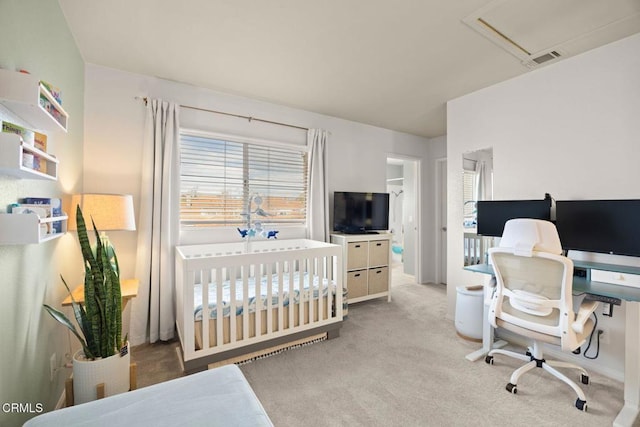 carpeted bedroom featuring visible vents