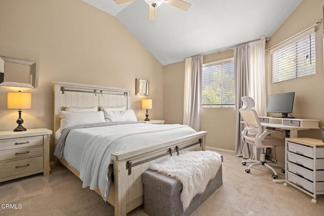 bedroom with vaulted ceiling, ceiling fan, baseboards, and light colored carpet