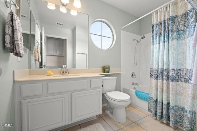 full bathroom featuring visible vents, toilet, shower / bath combo, vanity, and tile patterned flooring