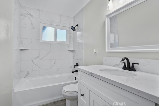 full bathroom featuring shower / bathing tub combination, vanity, and toilet