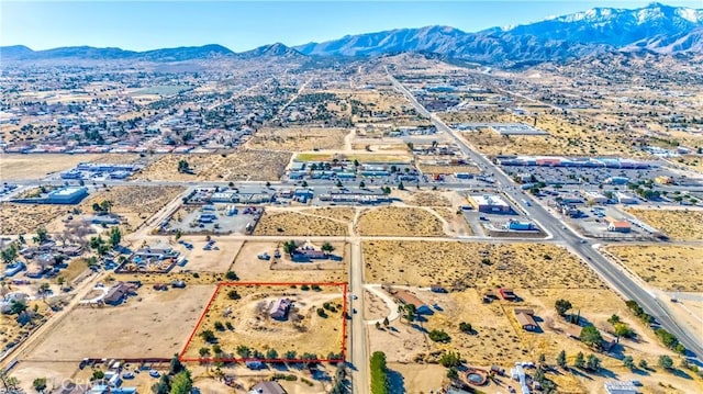 bird's eye view with view of desert and a mountain view