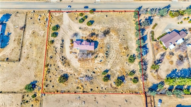 birds eye view of property with a desert view