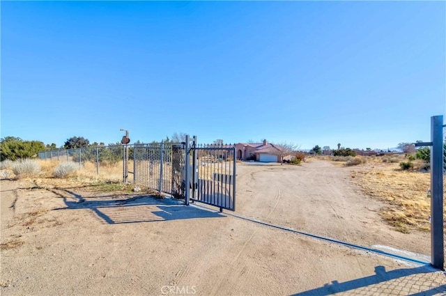 view of gate featuring fence