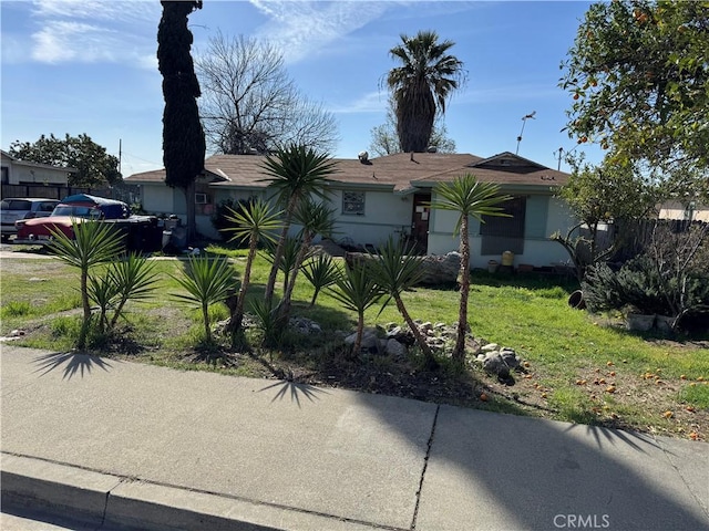 view of front of property with a front lawn and stucco siding