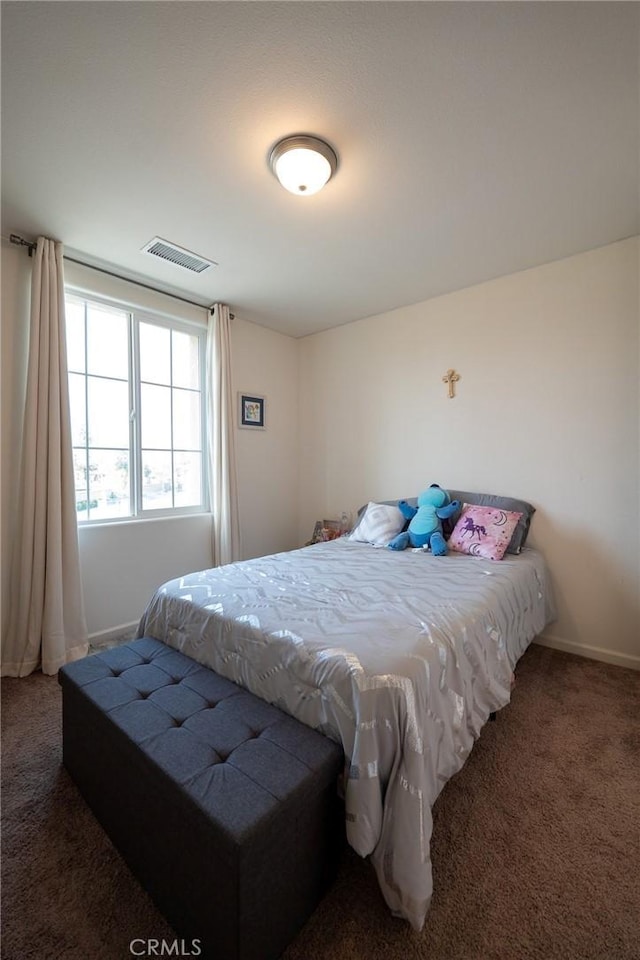 bedroom featuring carpet flooring, visible vents, and baseboards