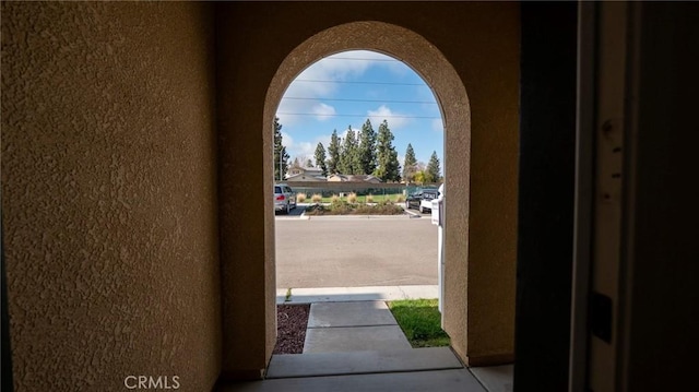 exterior space with a textured wall