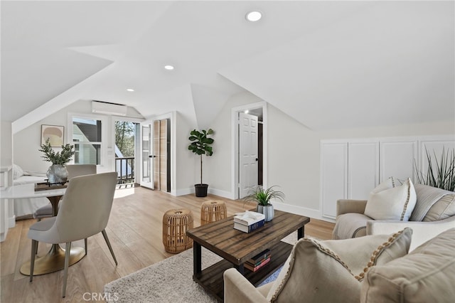 living room featuring light wood-type flooring, vaulted ceiling, baseboards, and recessed lighting