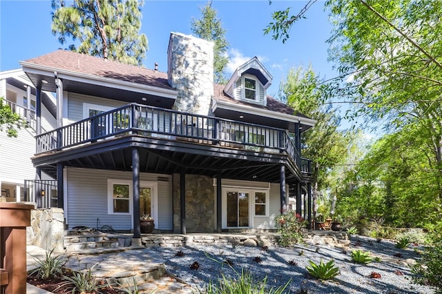 rear view of house with a chimney