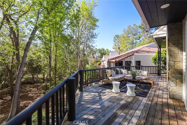 wooden terrace with an outdoor hangout area