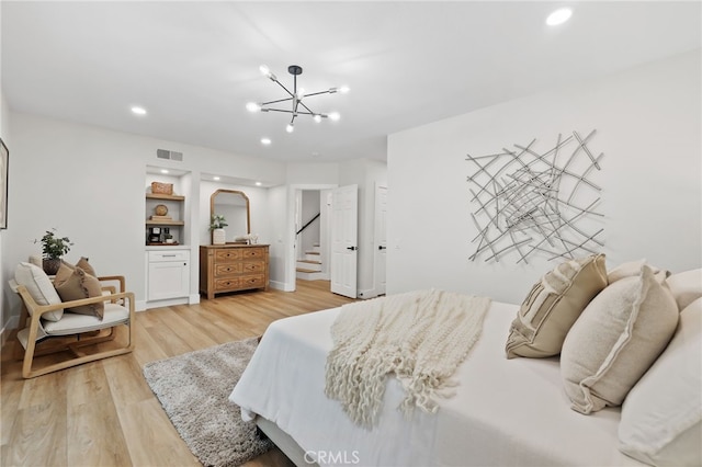 bedroom featuring a notable chandelier, recessed lighting, visible vents, light wood-style flooring, and baseboards