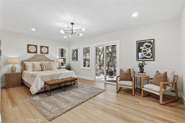 bedroom with light wood finished floors, baseboards, access to outside, a notable chandelier, and recessed lighting