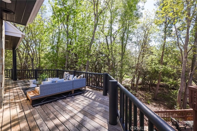 wooden terrace with outdoor lounge area