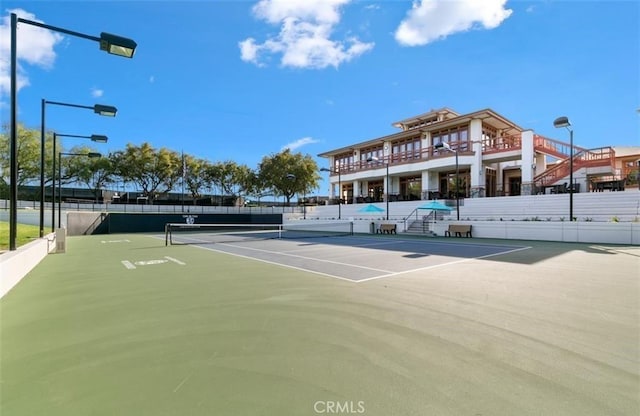 view of sport court with fence