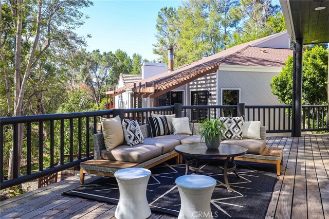 deck featuring outdoor lounge area