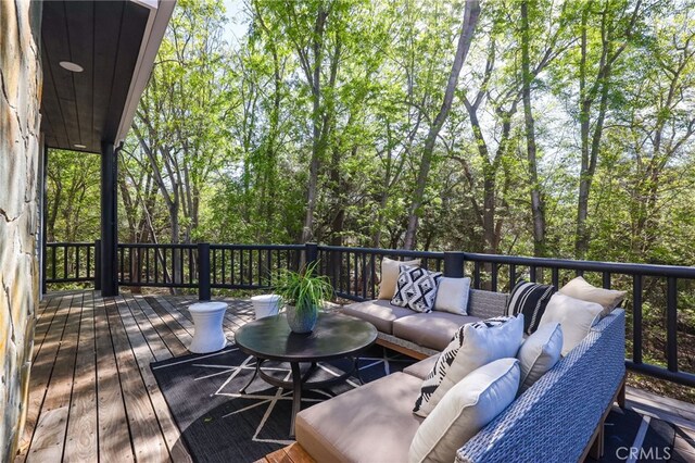 wooden deck with an outdoor hangout area