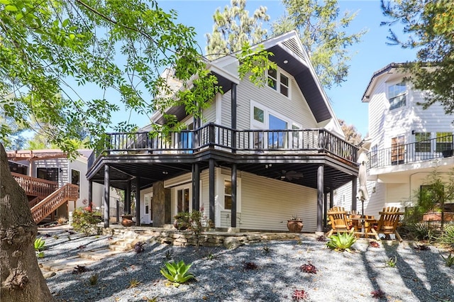 view of front of house with a carport and a wooden deck